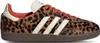 A single Adidas Samba OG sneaker with a leopard print pattern and orange laces, shown from the side against a white background. Podgląd zdjęcia produktu