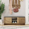 An entryway bench with storage, a coat rack with hanging items, and a plant. Produktbild-Vorschau