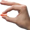 A hand holding a single earplug. Produktbild-Vorschau