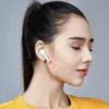 Close-up profile of a woman wearing white earbuds, with a graphic overlay indicating sound waves. Náhľad obrázku produktu