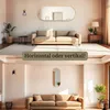 Two interior design scenes showing an oval mirror above a sofa, with text asking about horizontal or vertical placement. Produktbild-Vorschau