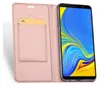 A pink flip case for a smartphone is shown open, with a smartphone displaying a colorful screen inside. Produktbild-Vorschau