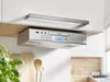 A Karcher RA 2050 under-cabinet radio with a CD player and USB charger is mounted under a kitchen cabinet. Produktbild-Vorschau