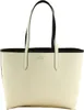 A studio shot of a beige and black tote bag. Voir les images du produit