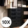 A closet interior with clothes hanging and stacked black shoe boxes. Podgląd zdjęcia produktu