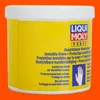 A yellow tub of Liqui Moly hand protection cream against an orange background. Produktbild-Vorschau