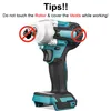 An image of a cordless impact wrench with instructional text and symbols. Náhled obrázku produktu