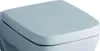 A close-up view of a white, square toilet seat. Podgląd zdjęcia produktu