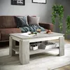 A modern living room scene featuring a couch, coffee table, and plants. Voir les images du produit
