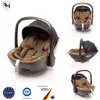 A collage of images showing a baby car seat from different angles, along with certification logos. Náhľad obrázku produktu