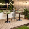 An outdoor patio scene at night with string lights, two rattan bar stools, and a small table. Voir les images du produit