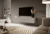 A modern living room with a wall-mounted TV and media console. Voir les images du produit