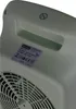 A close-up view of a label and part of a fan on a white appliance. Produktbild-Vorschau