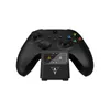 A black Xbox controller charging station with a controller on it, shown against a white background. Produktbild-Vorschau