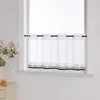A white sheer curtain with gray and black stripes at the bottom, hanging on a black rod in a window. Produktbild-Vorschau