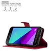 A red flip case for a Samsung Galaxy XCover 4 / XCover 4s phone is shown, with the phone inside and its screen displaying the time and a colorful wallpaper. The case is open, revealing its stand function with three different angle options illustrated above Produktbild-Vorschau