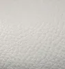 A close-up, textured view of a beige artificial leather material. Náhled obrázku produktu
