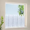 A white sheer curtain with a swirl pattern hangs across a window. Produktbild-Vorschau
