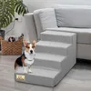 A corgi dog sits on a gray, four-step pet stair next to a couch. A woven basket with magazines is to the left. Náhled obrázku produktu