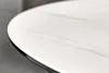 A close-up view of the edge of a round table with a white marble-patterned ceramic top and a black metal frame. Produktbild-Vorschau