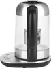 A side view of a BEEM Teatime II electric kettle with a glass body and stainless steel accents, placed on its charging base. Podgląd zdjęcia produktu