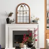 A decorative mirror above a fireplace mantel, styled with various decorative items. Náhľad obrázku produktu