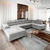 A modern living room with a large sectional sofa. Produktbild-Vorschau