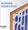 A close-up of a wooden picture frame with dimensions indicated, showing a blue and white abstract pattern behind it. Produktbild-Vorschau