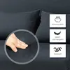 A close-up of a dark gray sofa with a hand pressing into the fabric, accompanied by feature callouts. Náhled obrázku produktu