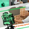 A construction worker is tiling a wall, with a laser level in the foreground projecting green lines. Náhled obrázku produktu