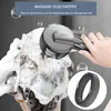 A hand is using a black shower head to massage a person's soapy hair. Produktbild-Vorschau