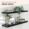 Two black floating shelves mounted on a white wall, decorated with books, plants, vases, and a picture frame. Produktbild-Vorschau