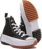 A pair of black Converse high-top sneakers with a thick white platform sole and a brown rubber sole. Náhled obrázku produktu