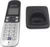 A cordless phone and its charging base are shown against a white background. Voir les images du produit