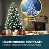 A decorated Christmas tree with presents underneath, next to a fireplace. Anteprima dell’immagine prodotto