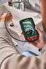 A person is using a digital inspection camera to look into a sink drain. Produktbild-Vorschau
