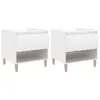 Two white nightstands with wooden legs are shown against a white background. Náhled obrázku produktu