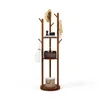A wooden coat rack with shelves and hooks, decorated with accessories. Náhľad obrázku produktu