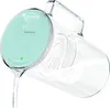 A clear pitcher with a mint green lid is shown, with water being poured out of it. Náhled obrázku produktu