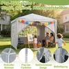 A family is enjoying a gazebo in a backyard setting, with children painting and playing. Voir les images du produit