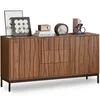 A wooden sideboard with decorative front panels and black metal legs, displayed on a white background with decorative items on top. Produktbild-Vorschau
