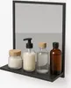 A bathroom mirror with a shelf displaying four bottles of toiletries. Produktbild-Vorschau