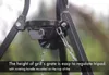 Close-up of a metal tripod mechanism with chains, with text overlay. Náhled obrázku produktu