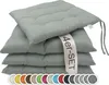A stack of four light gray seat cushions with ties, with a label indicating '4er-SET'. Below the cushions is a row of color swatches. Produktbild-Vorschau
