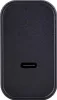 A close-up, top-down view of a black USB-C charging port on a dark, textured surface. Podgląd zdjęcia produktu