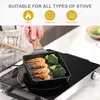 A person is holding a square frying pan with shrimp and broccoli on an induction stove. Náhľad obrázku produktu