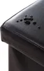 A close-up shot of the corner of a black upholstered storage bench with water droplets on the surface. Náhľad obrázku produktu