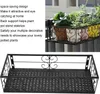 A collage showing a black metal balcony planter shelf with decorative scrollwork, and a close-up of the shelf holding potted plants on a balcony railing. Náhled obrázku produktu