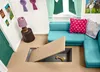 A toy playset interior with a couch, lamp, and a hidden compartment. Produktbild-Vorschau