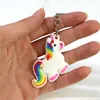 A hand holding a unicorn keychain. Produktbild-Vorschau